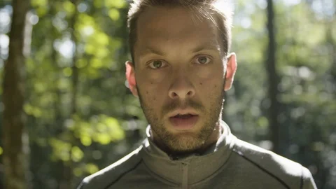 Young man looking straight into the camera Stock Footage 90740481