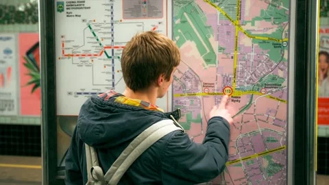 Young man looking at subway map Stock Footage 86315145