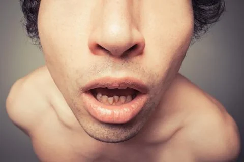 Young man looking surprised 스톡 사진