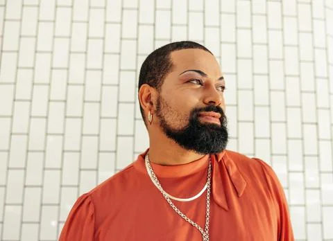 Young man looking thoughtful while wearing drag Stock Photos