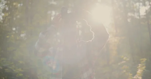 Young Man Looking Through Binocular Standing In Forest Video stock 252016957