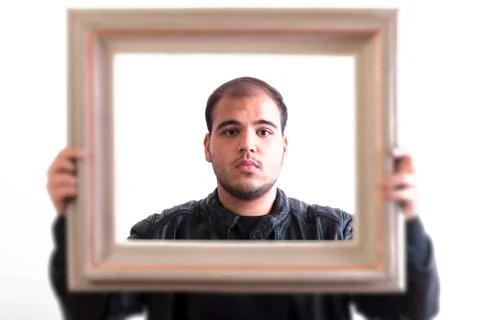 Young Man Looking Through Picture Frame Stock Photos