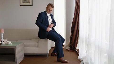 Young man looking at wedding rings Stock Footage 79789989