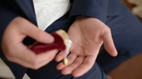 Young man looking at wedding rings Stock Footage 79789992