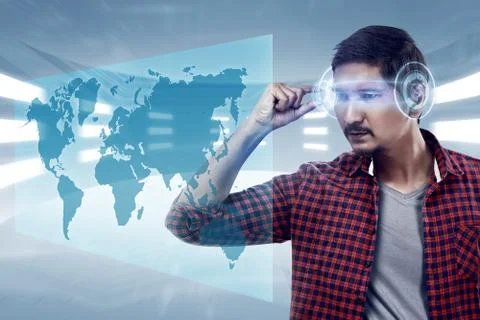 Young man looking world map with futuristic smart high tech glasses Stock Photos