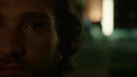 Young Man Looks into Camera Stock Footage 77207521