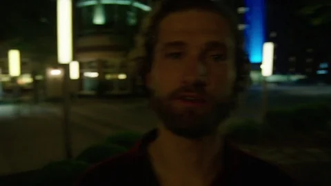 Young Man Looks into Camera Stock Footage 77207795