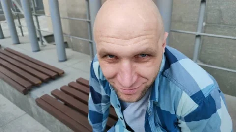 Young man looks at camera from under his brows 库存影片 202030153