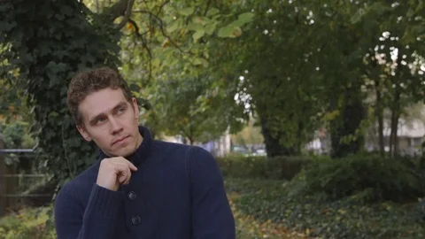 Young man looks confidently at the camera, dolly in Vídeo Stock 72681797