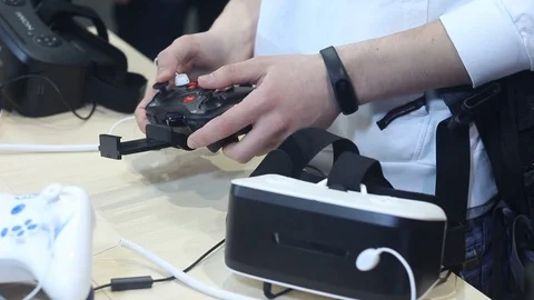 Young man looks at the quadrocopter control system Stock Footage 87136266