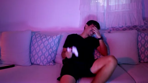 Young man losing at video game Stock Footage 289731153