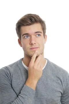 Young man lost in thought Stock Photos