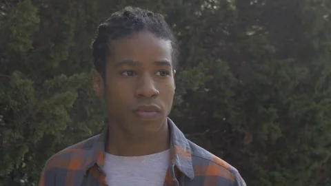 Young Man Lost in Thought Staring into Distance Stock Footage 121386091