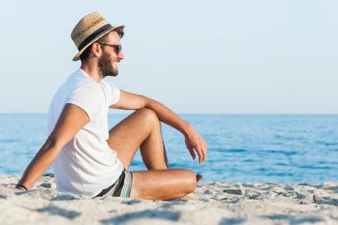 Young man lying on the beach Stock Photos