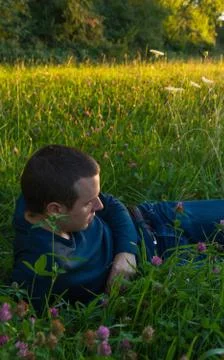 Young Man Lying in Grass 스톡 사진