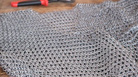 Young man make medieval chain armor with modern tools Stock-Footage 113187113