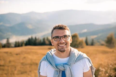 Young man make selfie on camera mountain landscape Stock Photos