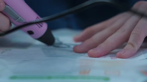 A young man makes a 3 d model with a pen Stock Footage 147038007