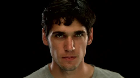 A young man makes an angry face Video stock 33830123