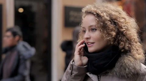 Young man makes a prank call to his beautiful woman - joke - cell phone Stockbeeldmateriaal 33594838