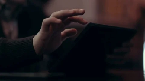 A young man makes a purchase in the online store using the tablet Stock Footage 71565296