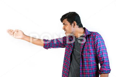 Young Man Making an Angry Gesture a Plain Background Stock Image #249891216