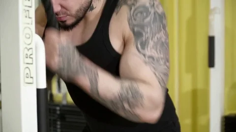 Young man making the biceps triceps bodybuilding workout closeup Stock Footage 74136536