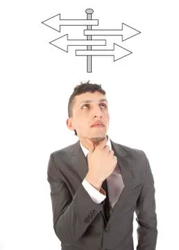 Young man making a choice with arrows isolated on white background Stock Photos