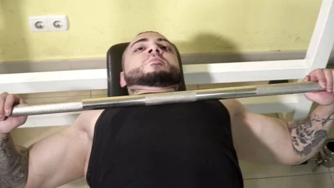 Young man making the close grip bench press exercises closeup Video stock 74137180