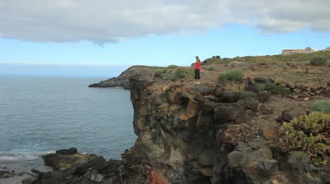 Young man making exercises outdoor. Sunny day. Location Tenerife. Video stock 65446742