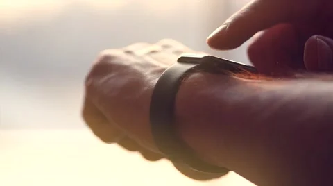 Young man making gestures on a wearable smart watch Stock Footage 67359583