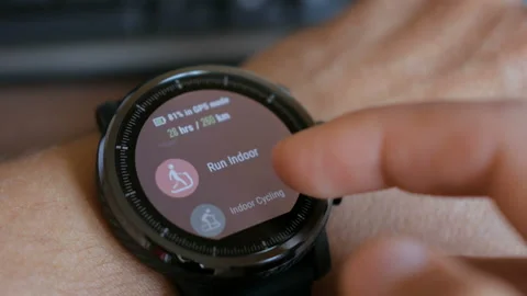 Young man making gestures on a wearable smart watch computer device, smartwat Stock Footage 90502001