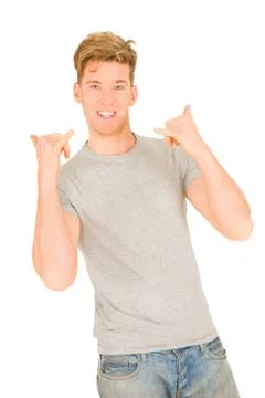 Young man making hang loose hand signals Stock Photos