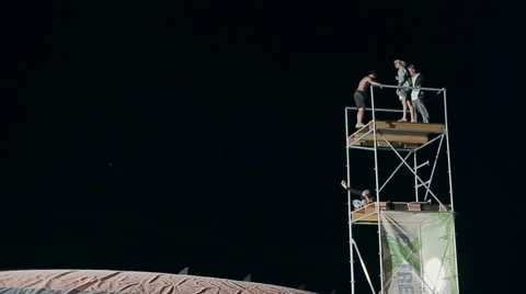 Young Man Making a Jump From a Springboard to to the Big Airbag Night. Slow Stock Footage 60681534
