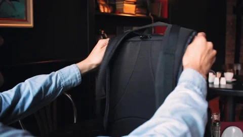 Young man making notes in the notepad in cafe 스톡 동영상 79036343