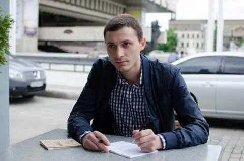 Young man making notes Stock Photos