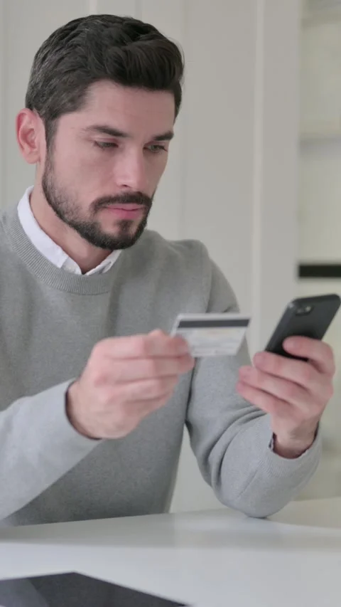 Young Man making Online Payment on Smartphone, Vertical Video Video stock 339582311
