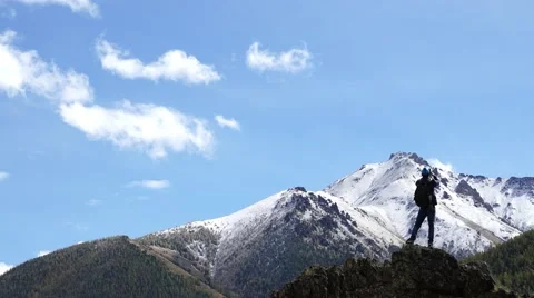 Young man making a phone call in mountains. Stock-Footage 55007939