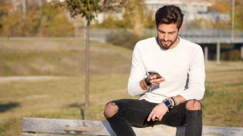 Young man making phone call outdoor in city Stock Photos