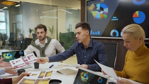 Young man making presentation for colleagues in meeting Video stock 132817826