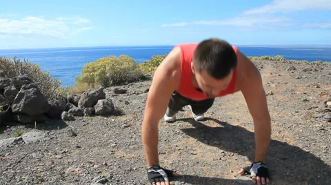 Young man making push-ups outdoors. Sunny day, dolly shot. 스톡 동영상 35509179