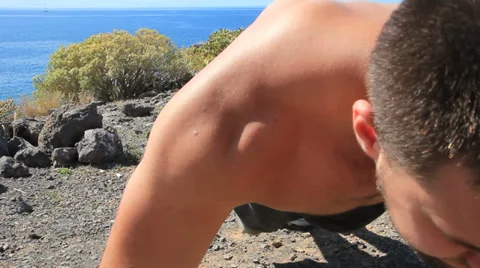 Young man making push-ups outdoors. Sunny day, dolly shot. Stock Footage 35510159
