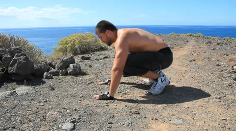 Young man making push-ups outdoors. Sunny day, dolly shot. Stock Footage 35511241