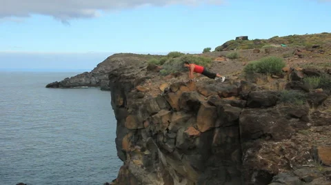 Young man making push-ups outdoors. Sunny day, dolly shot. Video stock 65446778