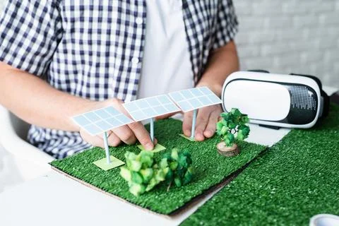 Young man making renewable energy project dummy Stock Photos