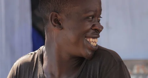 Young man is making a rolex, a popular street food in Uganda, combining an egg Stock Footage 109490549