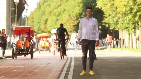 Young man making a selfie in a park Stock-Footage 65335302