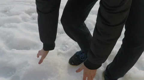 Young man making snowball Stock Footage 58797150