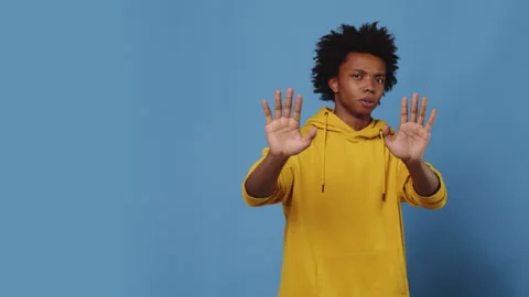 Young man is making stop gesture with his hands Stock Footage 282725016