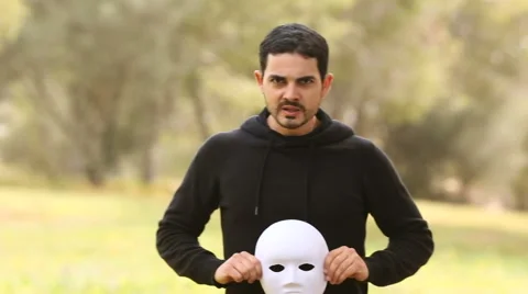 Young man with mask representing aggressive emotions Stock Footage 61860620